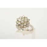 A MODERN ROUND DIAMOND CLUSTER RING, estimated modern round brilliant cut diamond weight