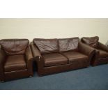 A MARKS AND SPENCERS BROWN LEATHER THREE PIECE SUITE, comprising a two seater settee, width 194cm