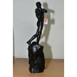 AN EARLY 20TH CENTURY BRONZED METAL FIGURE OF A YOUNG MAN WEARING A LOIN CLOTH, his body turned to