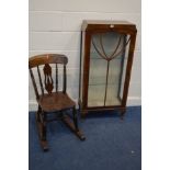 A 1930'S WALNUT SINGLE DOOR CHINA CABINET, together with a stained beech rocking chair (2)