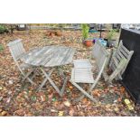 A SET OF THREE FOLDING HARDWOOD GARDEN CHAIRS and another ( missing it's seat slats) and a