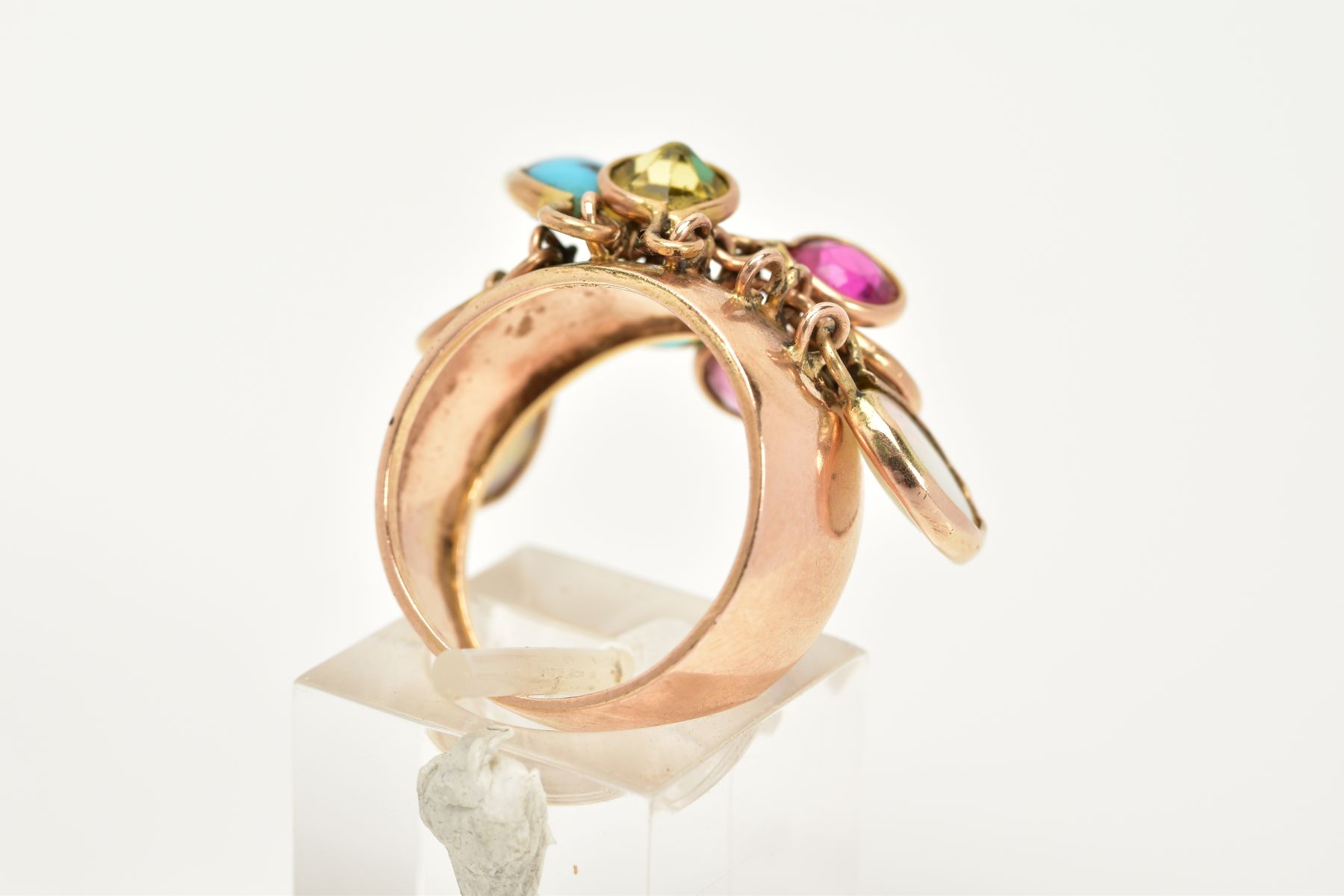 A YELLOW METAL MULTI-GEMSTONE RING, the plain polished wide shank, suspends nine drops containing - Image 3 of 4