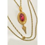 A MID VICTORIAN GARNET AND WHITE ENAMEL PENDANT NECKLACE, the yellow metal pendant of oval design