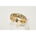 A 9CT GOLD FULL ETERNITY RING, set with circular cut colourless spinels, with a textured border,