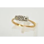 A YELLOW METAL THREE STONE DIAMOND RING, set with single cut diamonds, one diamond is missing,