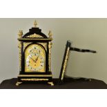 A LATE 19TH CENTURY GEORGE III STYLE EBONISED AND GILT METAL STRIKING AND QUARTER CHIMING BRACKET