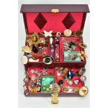 A BURGUNDY JEWELLERY BOX WITH CONTENTS, to include items such as tumble stone pendants of various