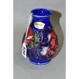 A MOORCROFT POTTERY VASE, 'Anemone' pattern on blue ground, impressed backstamp and painted
