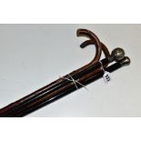 TWO SILVER TOPPED WALKING CANES, (one with dent), length 90cm, together with two walking sticks, one
