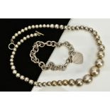 A WHITE METAL BALL NECKLACE AND CHARM BRACELET, the necklace designed as plain polished graduated