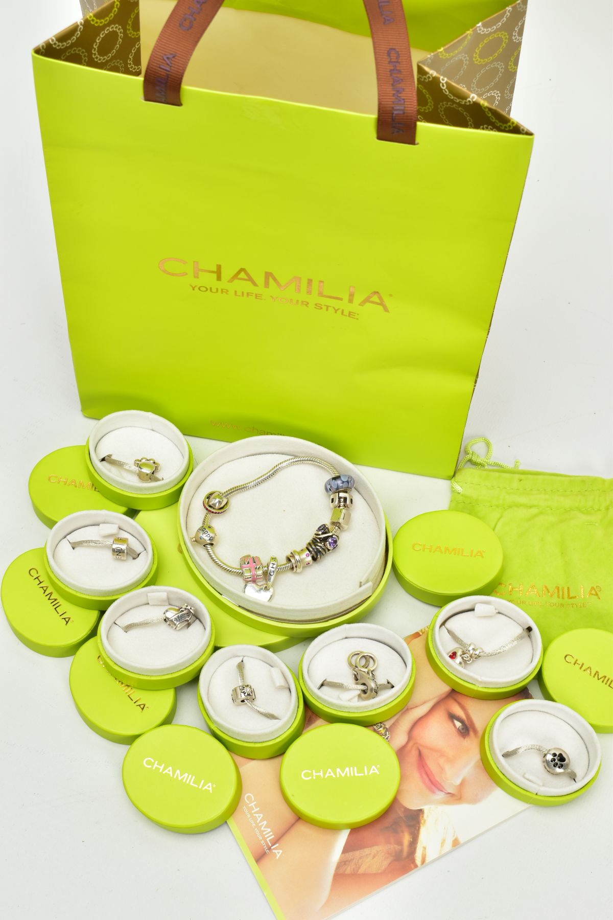 A CHAMILIA CHARM BRACELET, together with assorted plain, crystal and enamelled charms,