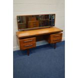 A G PLAN FRESCO TEAK DRESSING TABLE with a swinging rectangular mirror and four drawers flanking a