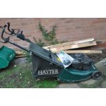 A HAYTER HARRIER 41 PETROL LAWN MOWER with electric start (engine pulls freely but hasn't been