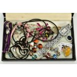 A SELECTION OF COSTUME JEWELLERY, to include two white metal charm bracelets with charms, a pink