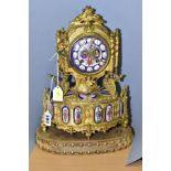 A LATE 19TH CENTURY FRENCH GILT METAL AND PORCELAIN LEROY & FILS MANTEL CLOCK, the finial with two