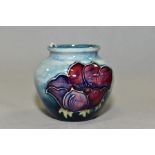 A SMALL MOORCROFT POTTERY VASE, 'Anemone' pattern on light blue ground, impressed back stamp