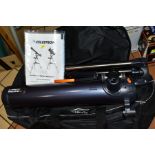 A CELESTRON ASTROMASTER 76 TELESCOPE, with stand, manual and canvas bag