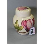 A SMALL MOORCROFT POTTERY GINGER JAR, 'Magnolia pattern' on cream ground, impressed back stamp,