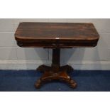 A 20TH CENTURY REGENCY STYLE ROSEWOOD CARD TABLE, rounded front corners with a fold over top, on a