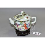 A 20TH CENTURY CHINESE PORCELAIN FAMILLE ROSE TEAPOT, of circular form, with peach finial, decorated