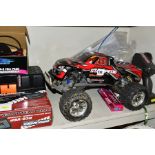 A REMOTE CONTROL TRAXXAS STAMPEDE WHEELSPIN TRUCK AND A QUANTITY OF ACCESSORIES, SPARE PARTS AND