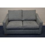 A GREY UPHOLSTERED TWO SEATER SOFA BED