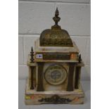 AN EARLY 20TH CENTURY MARBLE AND BRASS FRENCH MANTEL CLOCK, with a Roman figure finial, the brass