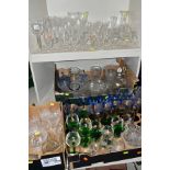 THREE BOXES OF GLASSWARE AND LOOSE GLASSWARE, mostly drinking glasses, some coloured sets, Waterford