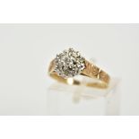 A 9CT GOLD DIAMOND CLUSTER RING, the raised cluster with illusion set single cut diamonds, with