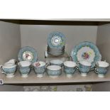 A ROYAL ALBERT 'ENCHANTMENT' PATTERN TEA SET, comprising a milk jug, two bread and butter plates,