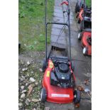 A HOMELITE PETROL LAWN MOWER with grass box (engine pulls freely but hasn't been started)