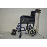 AN INVA-CARE WHEEL CHAIR with seat pad and two foot rests