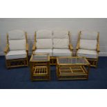 A WICKER FIVE PIECE CONSERVATORY SUITE, with oatmeal cushions, comprising a two seater settee,