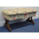 A VICTORIAN ROSEWOOD SERPENTINE STOOL, later floral buttoned upholstery, on twin foliate and