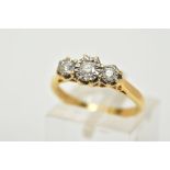 AN 18CT GOLD THREE STONE DIAMOND RING, designed with three star set, graduated round brilliant cut