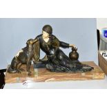 AFTER MENNEVILLE, an art deco patinated spelter and ivorine model of a seated lady with seated