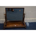 A 19TH CENTURY WALNUT TOILET MIRROR, on a rectangular base (some veneer loose but not missing)