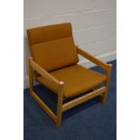 A 1970'S/80'S BEECH FRAMED OPEN ARMCHAIR, with Pirelli spring and russet coloured cushions