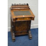 A LATE VICTORIAN WALNUT DAVENPORT, fretwork gallery on a hinged stationary compartment, a sloping