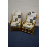 A PAIR OF WICKER CONSERVATORY ARMCHAIRS with cushions