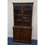 A MODERN MAHOGANY DOUBLE DOOR BOOKCASE, with two drawers, width 100cm x depth 41cm x height 201cm (