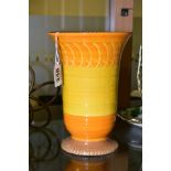 A SHELLEY HARMONY VASE OF CONICAL FORM ON A SHORT PEDESTAL, orange, yellow and brown glazes, printed