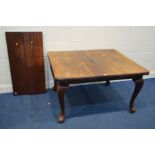 A VICTORIAN MAHOGANY WIND OUT DINING TABLE, two additional leaves, on cabriole legs, extended length