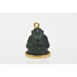 AN 18CT GOLD MOUNTED CARVED BLOODSTONE PENDANT, the carved bloodstone in the form of a buddha,