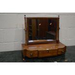 AN EARLY 19TH CENTURY SATINWOOD TOILET MIRROR, with three drawers, width 65cm (key)