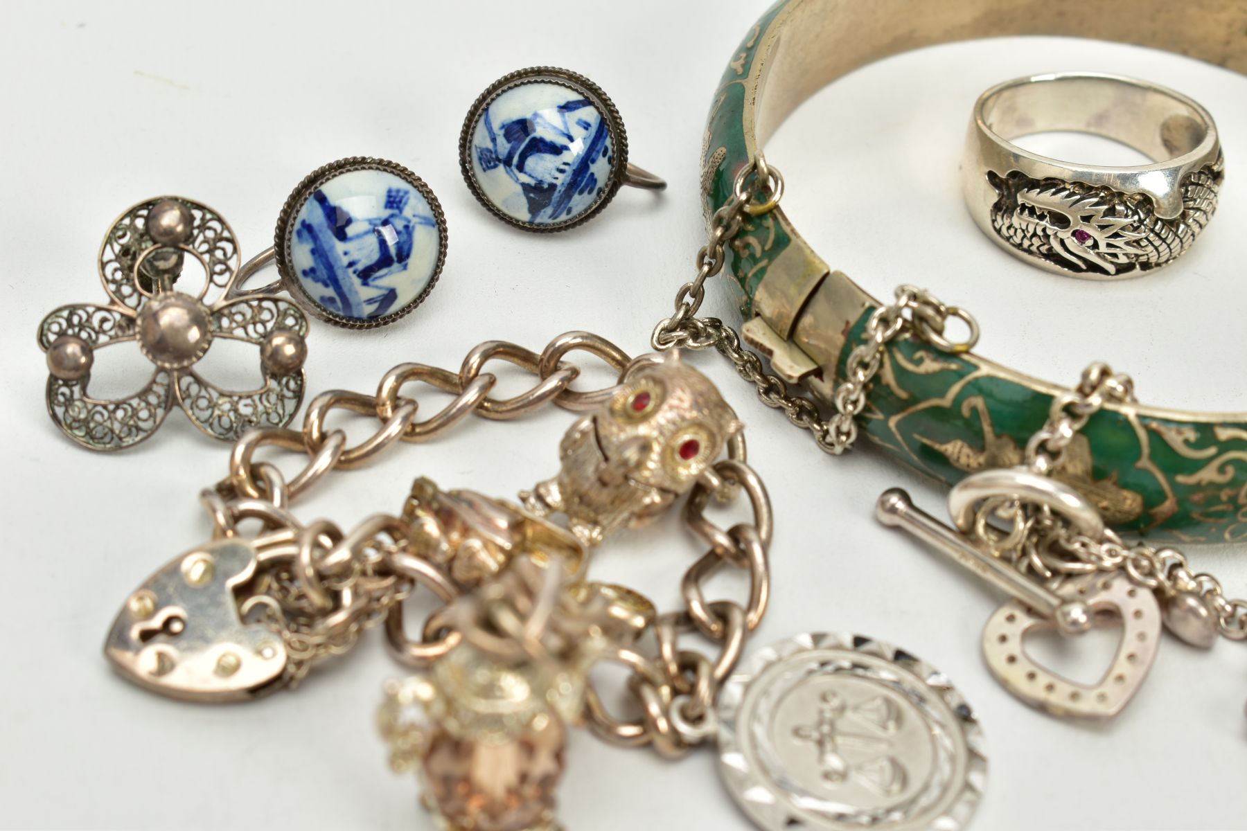 A SELECTION OF JEWELLERY, to include a silver charm bracelet, suspending four white metal charms - Image 4 of 4