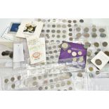 A SHOEBOX OF WORLD COINS to include Royal Mint carded coins, five and two pound coins, eighty nine