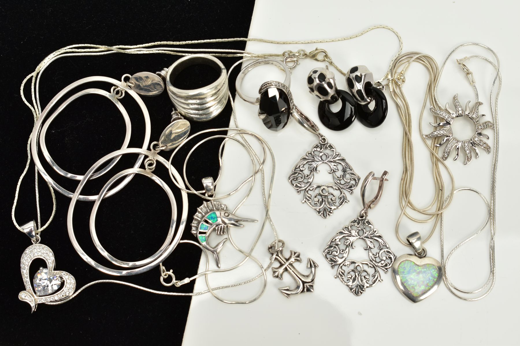 A COLLECTION OF WHITE METAL ASSORTED JEWELLERY ITEMS to include an onyx and marcasite ring, onyx and