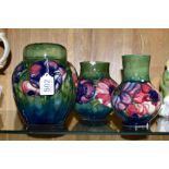 THREE PIECES OF MOORCROFT POTTERY, all 'Anemone' pattern on a green ground, comprising ginger jar,
