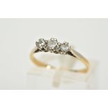 A THREE STONE DIAMOND RING, the yellow metal ring, set with three graduated round brilliant cut